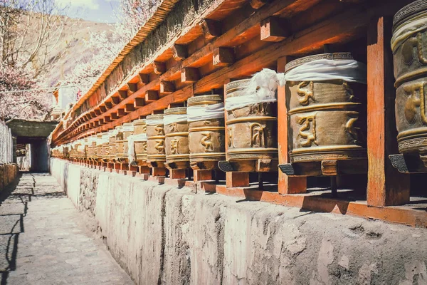 A row of golden prayer wheels Royalty Free Stock Images